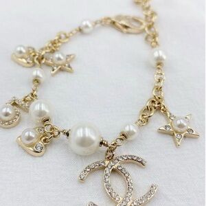 Gold and Pearl Charm Bracelet with Logo Pendant